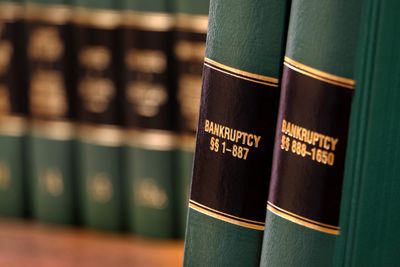 Bankruptcy law volumes standing on a shelf