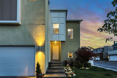 A residential property at dusk, offered in an online real estate auction